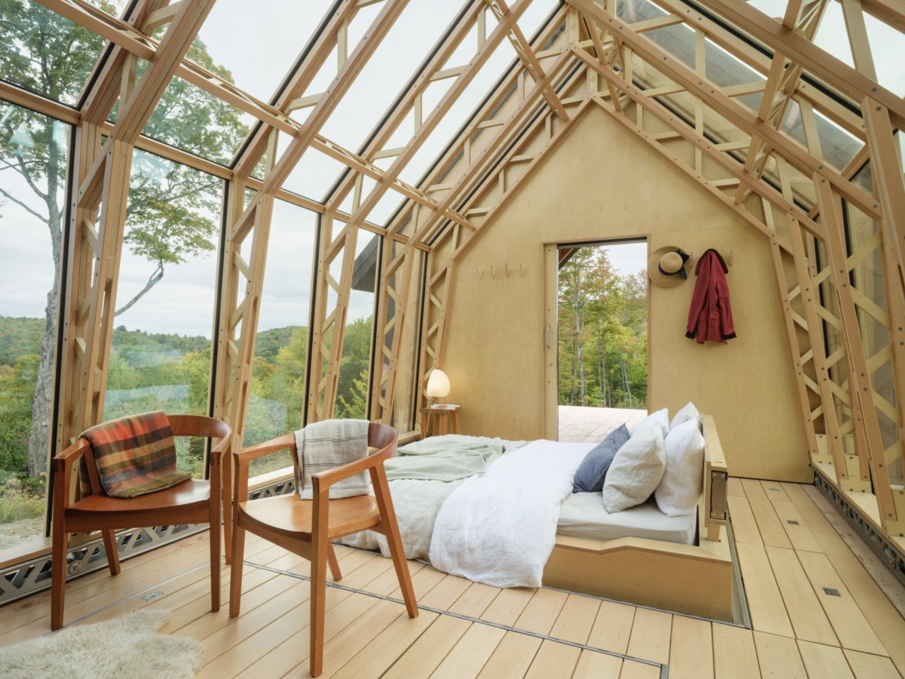 Inside Cabin ANNA with its main shell open to the surrounding forest
